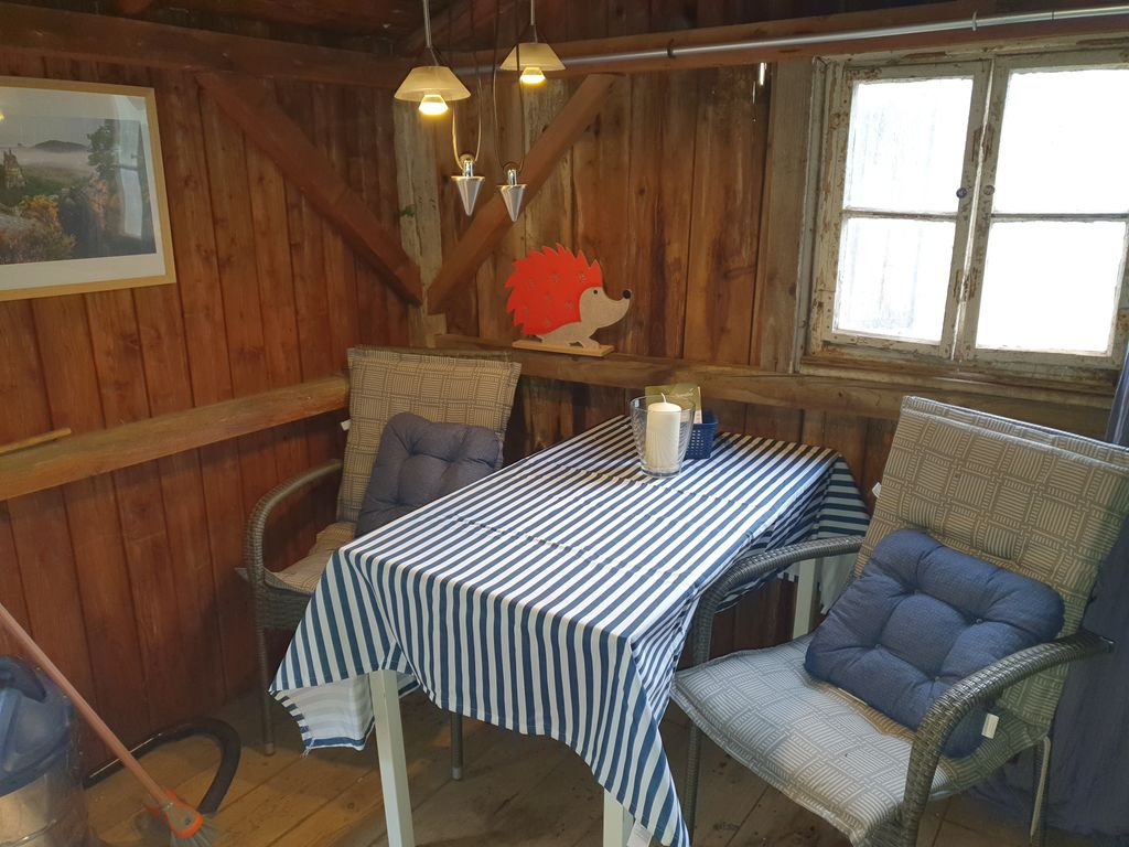 Spend the night in the wooden hut right on the edge of the forest