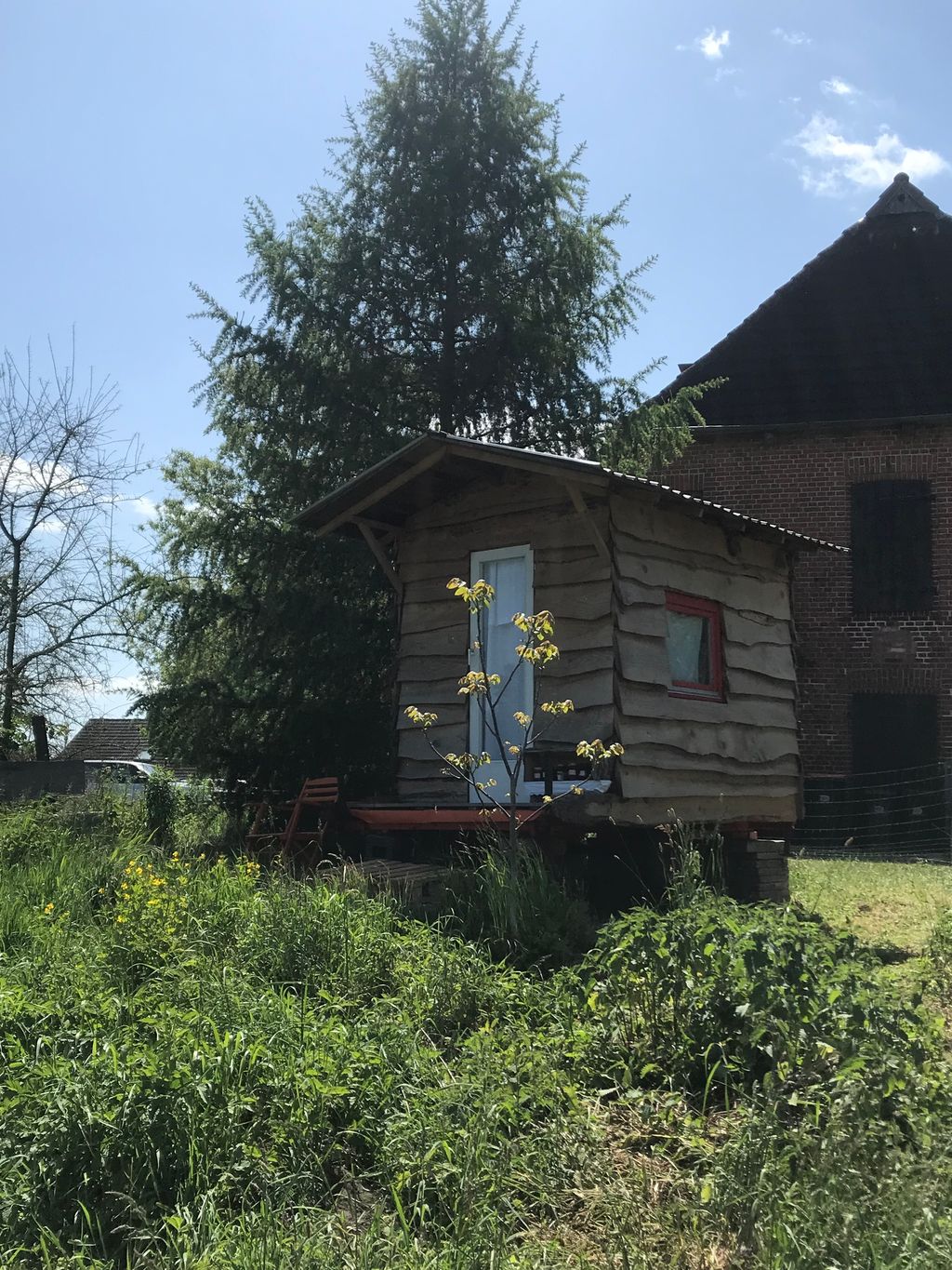 Farm camping between stream and meadows