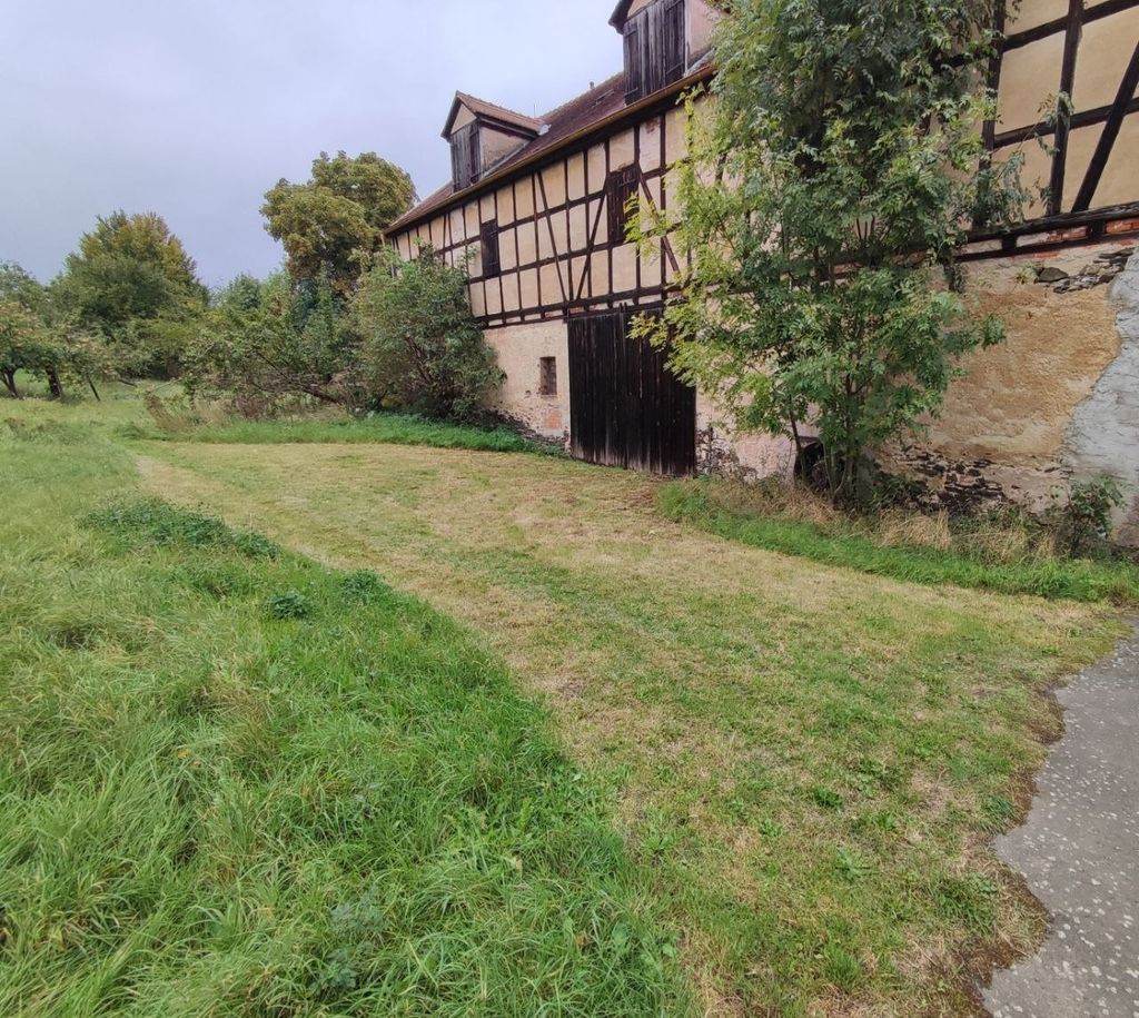 Nature camping with a view of half-timbered houses