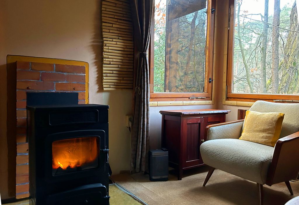 Living room with a view of the fireplace and the lake