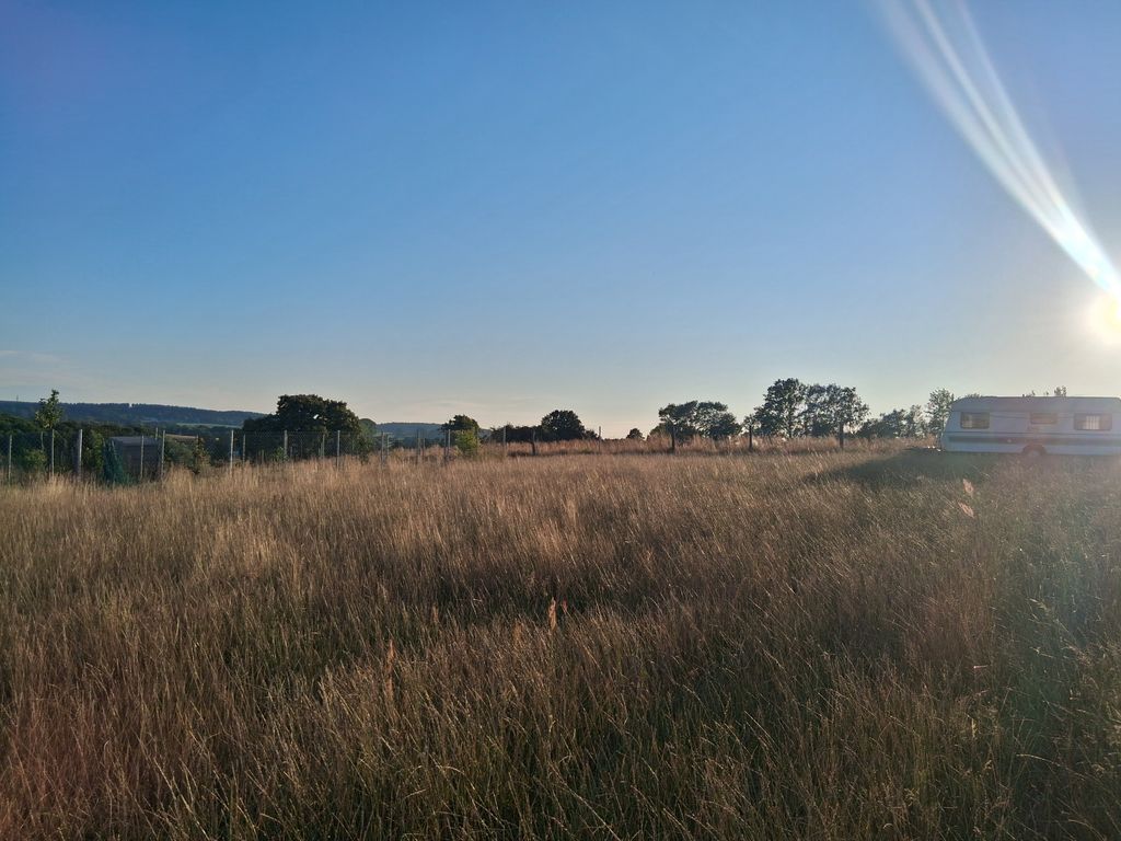 Camping spot on a spacious meadow by the Baltic Sea