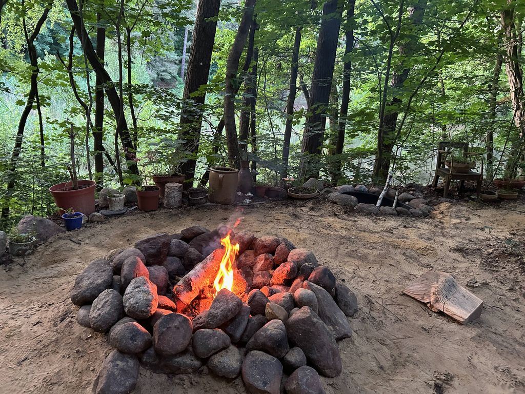 Fire pit in front of the forest raft
