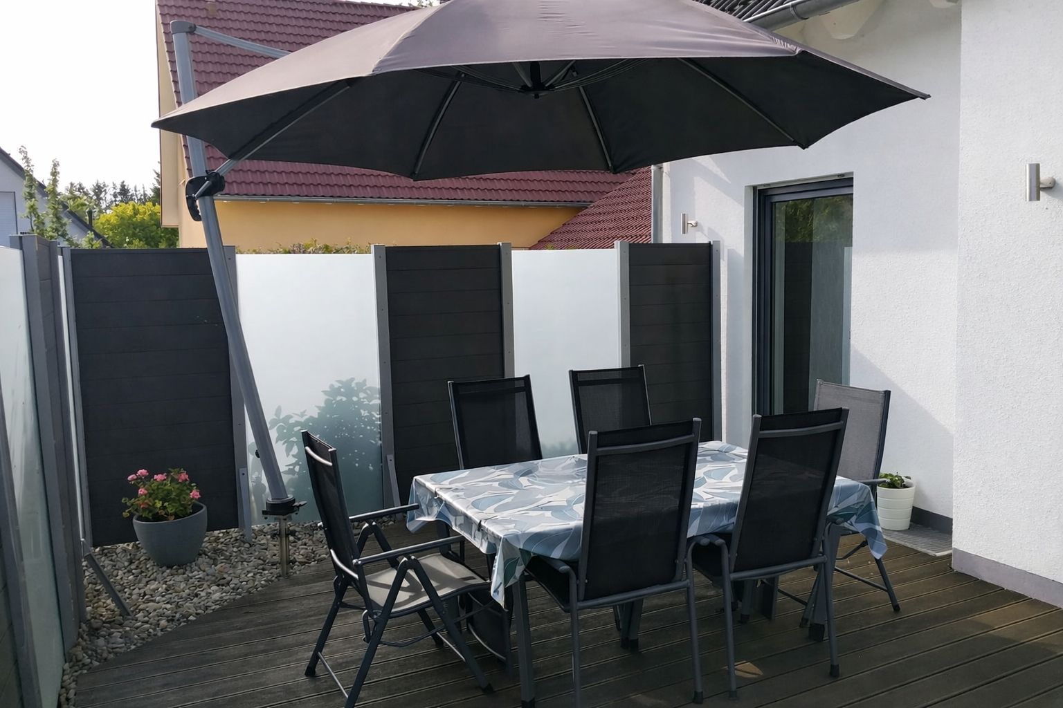 South-facing terrace with a parasol,