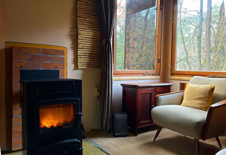 Living room with a view of the fireplace and the lake